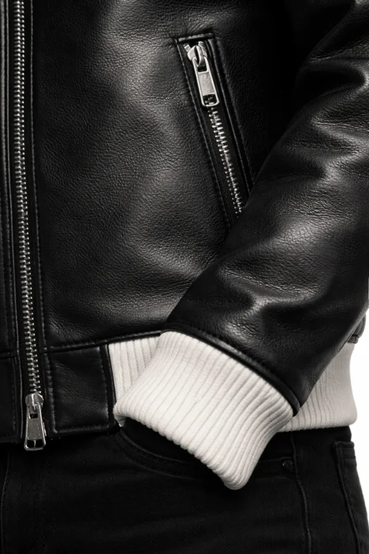 Close-up of fabric and stitching on Marty Supreme Black Bomber Jacket
