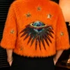 S03 Elsbeth Carrie Preston Orange Faux Fur Jacket