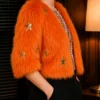 S03 Elsbeth Carrie Preston Orange Faux Fur Jacket