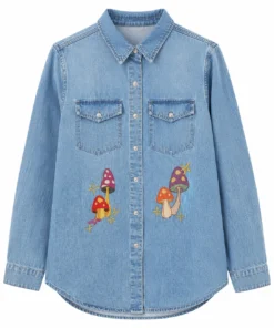 Bring screen-inspired fashion to your wardrobe with the Sadie Soverall Every Year After 2026 Embroidered Denim Snap-Up Shirt. Inspired by the character Percy Fraser, portrayed by Sadie Soverall in the romantic drama series Every Year After, this stylish blue denim shirt captures the relaxed, nature-inspired aesthetic seen throughout the show. Crafted from premium-quality denim, this women's snap-up shirt features eye-catching embroidered mushroom artwork that adds a playful boho touch to a timeless wardrobe staple. The classic shirt collar, dual flap chest pockets, and comfortable relaxed fit make it ideal for layering over tanks, tees, or dresses throughout every season. With embroidered denim continuing to trend in contemporary fashion, this versatile piece blends vintage charm with modern casual style, making it perfect for everyday wear, travel outfits, festivals, and weekend adventures. Whether you're a fan of Every Year After or simply looking for a standout embroidered denim shirt, this Percy Fraser-inspired piece delivers comfort, character, and effortless style.