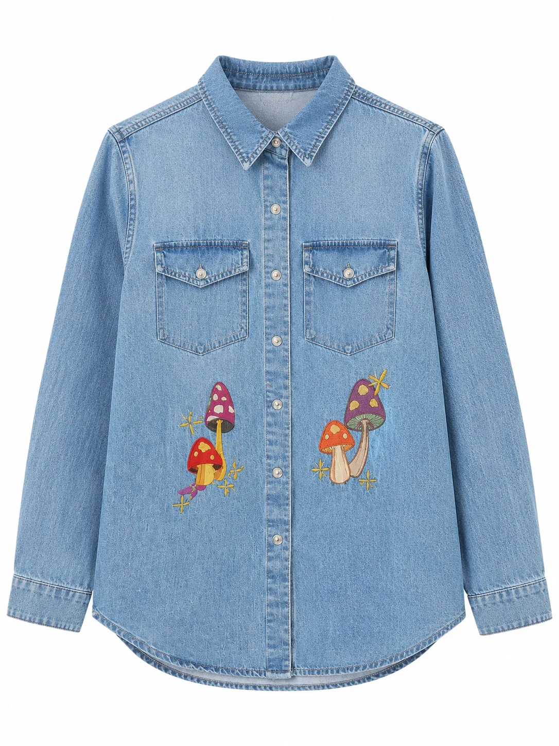 Bring screen-inspired fashion to your wardrobe with the Sadie Soverall Every Year After 2026 Embroidered Denim Snap-Up Shirt. Inspired by the character Percy Fraser, portrayed by Sadie Soverall in the romantic drama series Every Year After, this stylish blue denim shirt captures the relaxed, nature-inspired aesthetic seen throughout the show. Crafted from premium-quality denim, this women's snap-up shirt features eye-catching embroidered mushroom artwork that adds a playful boho touch to a timeless wardrobe staple. The classic shirt collar, dual flap chest pockets, and comfortable relaxed fit make it ideal for layering over tanks, tees, or dresses throughout every season. With embroidered denim continuing to trend in contemporary fashion, this versatile piece blends vintage charm with modern casual style, making it perfect for everyday wear, travel outfits, festivals, and weekend adventures. Whether you're a fan of Every Year After or simply looking for a standout embroidered denim shirt, this Percy Fraser-inspired piece delivers comfort, character, and effortless style.